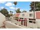 Charming two-story condo with red tile roof, lush greenery, and blooming flowers at 6009 N 79Th St, Scottsdale, AZ 85250