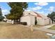 This exterior side view shows a low-maintenance landscape, neutral paint, and red tile roof at 6009 N 79Th St, Scottsdale, AZ 85250