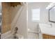 Bathroom showcases a shower over tub, tile and bright vanity at 625 W Central Ave, Coolidge, AZ 85128