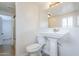 Bathroom offers a pedestal sink and toilet at 625 W Central Ave, Coolidge, AZ 85128