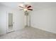 Bedroom featuring tile floors, white walls and a ceiling fan with light fixture at 625 W Central Ave, Coolidge, AZ 85128