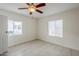 Bright bedroom featuring tile flooring and a ceiling fan for added comfort at 625 W Central Ave, Coolidge, AZ 85128