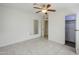 Spacious bedroom features tile floors, a ceiling fan, and a glimpse into the closet space at 625 W Central Ave, Coolidge, AZ 85128