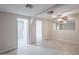 A well-lit living space features tile floors, white walls, and doorways leading to other parts of the home at 625 W Central Ave, Coolidge, AZ 85128