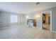 Bright living room featuring tile flooring, a decorative fireplace, built-in shelving, and recessed lighting at 625 W Central Ave, Coolidge, AZ 85128