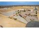 An aerial view of a desert property, showcasing a residence with a pool and ample outdoor space at 6786 W Appaloosa Trl, Coolidge, AZ 85128