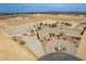 Aerial view of a meticulously landscaped property featuring circle drive, desert landscaping and pool at 6786 W Appaloosa Trl, Coolidge, AZ 85128