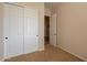 Cozy bedroom with plush carpet, closet and a calming neutral color scheme at 6786 W Appaloosa Trl, Coolidge, AZ 85128