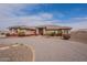 Single story stucco home featuring circular driveway and tiled roof at 6786 W Appaloosa Trl, Coolidge, AZ 85128