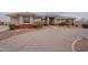 Single story stucco home featuring circular driveway and tiled roof at 6786 W Appaloosa Trl, Coolidge, AZ 85128