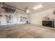 Well-lit garage interior featuring organized storage solutions and a clean, functional space at 6786 W Appaloosa Trl, Coolidge, AZ 85128