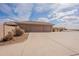 Three car garage and long driveway provide ample parking space at 6786 W Appaloosa Trl, Coolidge, AZ 85128