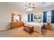 Spacious main bedroom featuring a large dresser, comfy carpet, and natural light at 6786 W Appaloosa Trl, Coolidge, AZ 85128