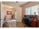 Bright home office with a wooden desk, natural light, and an inviting entrance at 6786 W Appaloosa Trl, Coolidge, AZ 85128