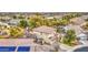 A view of an attractive house featuring a tile roof, well-kept landscaping, and community amenities at 7010 S San Jacinto Ct, Gilbert, AZ 85298