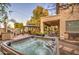 Inviting backyard with hot tub, gazebo, BBQ area and covered patio, perfect for outdoor living at 7010 S San Jacinto Ct, Gilbert, AZ 85298