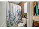 Charming bathroom featuring a cactus-themed shower curtain and desert-inspired decor at 7010 S San Jacinto Ct, Gilbert, AZ 85298