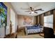 Comfortable bedroom featuring a ceiling fan, carpet, and a serene decorative aesthetic at 7010 S San Jacinto Ct, Gilbert, AZ 85298