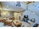 A living room boasting high ceilings, a staircase, neutral tones, with cozy sofas and a decorative chandelier at 7010 S San Jacinto Ct, Gilbert, AZ 85298