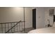 Bedroom features black rod iron railing and black door at 7126 N 19Th Ave # 193, Phoenix, AZ 85021