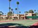 Community tennis court with desert landscaping and view of stucco apartments at 7126 N 19Th Ave # 193, Phoenix, AZ 85021