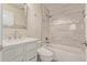 A modern bathroom featuring a shower/tub combo with decorative tile and modern vanity at 7130 W Linda Ln, Chandler, AZ 85226