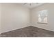 Bright bedroom with hardwood floors, a ceiling fan, and one window at 7130 W Linda Ln, Chandler, AZ 85226