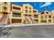 Exterior view features a townhome with a garage and staircase leading to the entrance at 7130 W Linda Ln, Chandler, AZ 85226