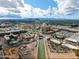 Aerial view of city with canal, commercial buildings and mountain background at 7151 E Rancho Vista Dr # 1017, Scottsdale, AZ 85251