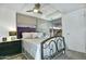 Comfortable bedroom featuring a wrought iron bed frame and a ceiling fan with integrated lighting at 7151 E Rancho Vista Dr # 1017, Scottsdale, AZ 85251