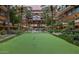 Exterior view of multi-story condo building with putting green at 7151 E Rancho Vista Dr # 1017, Scottsdale, AZ 85251