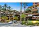 Modern multi-story building with balconies and mature landscaping at 7151 E Rancho Vista Dr # 1017, Scottsdale, AZ 85251