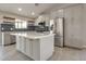 Modern kitchen featuring stainless steel appliances, quartz countertops, and stylish backsplash at 726 E Aire Libre Ave, Phoenix, AZ 85022