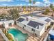 Home aerial view with a private pool, charming pergola, and modern solar panels at 790 N Meadows Dr, Chandler, AZ 85224