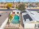 Property aerial view featuring a stunning pool, well-kept landscaping, and solar panel at 790 N Meadows Dr, Chandler, AZ 85224