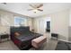 Bedroom with a black upholstered bed and a ceiling fan at 790 N Meadows Dr, Chandler, AZ 85224