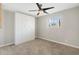 Bedroom with a ceiling fan, closet, and window at 790 N Meadows Dr, Chandler, AZ 85224