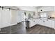 Bright kitchen with granite counters, white cabinets, and stainless steel trash can at 790 N Meadows Dr, Chandler, AZ 85224