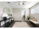 Bright living room with dark floors, neutral walls, a ceiling fan, and stylish decor at 790 N Meadows Dr, Chandler, AZ 85224