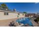 Backyard view of in-ground pool, pergola, and solar panels at 790 N Meadows Dr, Chandler, AZ 85224