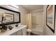 Cozy bathroom featuring a marble vanity top, sleek black faucet, and bathtub with shower at 7950 E Keats Ave # 150, Mesa, AZ 85209