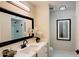 Bathroom with a marble vanity top, sleek black faucet and modern accents at 7950 E Keats Ave # 150, Mesa, AZ 85209