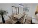 Beautiful dining room with a rustic wood table, seating for six and modern light fixture at 7950 E Keats Ave # 150, Mesa, AZ 85209