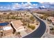 Panoramic aerial shot of a desert community with mountain views and neatly planned residential streets at 8142 S Open Trail Ln, Gold Canyon, AZ 85118