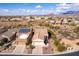 Scenic aerial view of a desert neighborhood with mountain views, featuring homes with tile roofs at 8142 S Open Trail Ln, Gold Canyon, AZ 85118