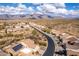 Desert neighborhood view, featuring mountain views, wide streets, and tile roofs at 8142 S Open Trail Ln, Gold Canyon, AZ 85118