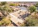 Aerial shot of a home featuring desert landscaping, walkways, and mature trees at 8142 S Open Trail Ln, Gold Canyon, AZ 85118