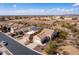 Aerial view of a neighborhood featuring single-story homes with tile roofs and desert landscaping at 8142 S Open Trail Ln, Gold Canyon, AZ 85118