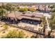 Aerial shot of a home featuring a covered patio and lush landscaping at 8142 S Open Trail Ln, Gold Canyon, AZ 85118