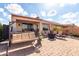 Relaxing backyard with a hot tub, seating area, and covered patio at 8142 S Open Trail Ln, Gold Canyon, AZ 85118